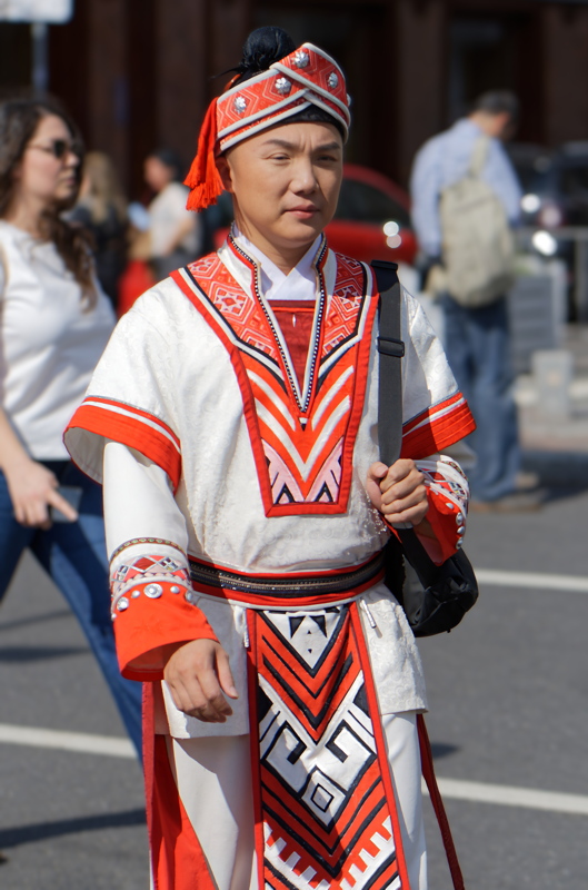 15 - Chinese man in traditional ethnic attire going in Bucharest
